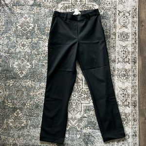 Black trousers with stripe down both pant legs. Size 4, never worn!